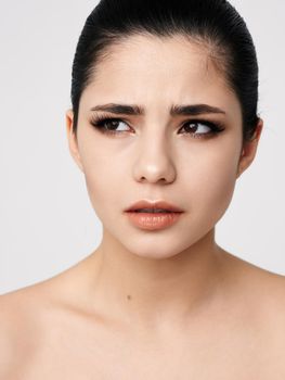pretty woman cosmetics on face naked shoulders clear skin model. High quality photo