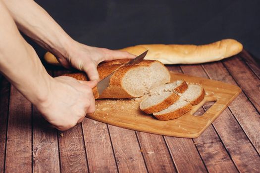 fresh sliced loaf yellow napkin wooden table baked goods. High quality photo
