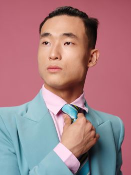 Handsome man asian appearance lifestyle confident manager pink background. High quality photo