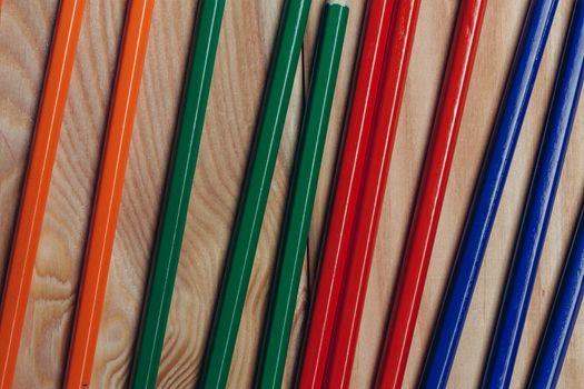 multicolored pencils object on work table wooden background office close-up. High quality photo