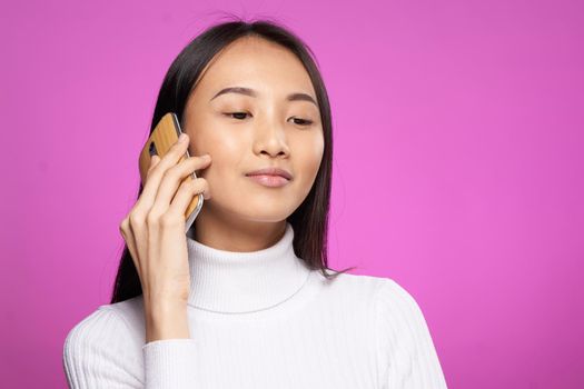 cute asian woman talking on the phone internet communication technology. High quality photo