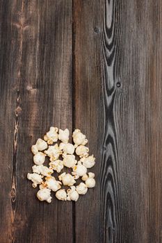 popcorn on a wooden table snack classic delicacy entertainment. High quality photo