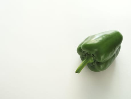 Ripe bell pepper, red, green, close-up on a white background.