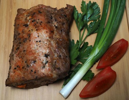 Food. Meat baked in the oven with vegetables. Close-up.