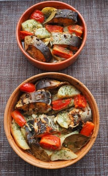 A dish of fish with vegetables baked in the oven. Close-up.