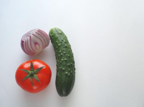 fresh vegetables for salad, close-up on a white background.