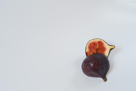 Food. Exotic fruit. Purple figs close up on a white background. High quality photo