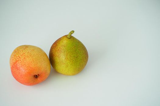 Fruit. Two ripe pears. Close-up. White background