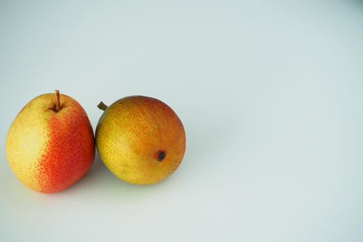 Fruit. Two ripe pears. Close-up. White background