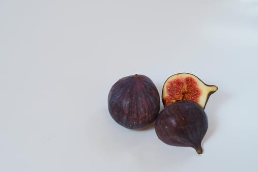 Food. Exotic fruit. Purple figs close up on a white background. High quality photo