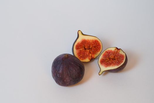 Food. Exotic fruit. Purple figs close up on a white background. High quality photo. High quality photo