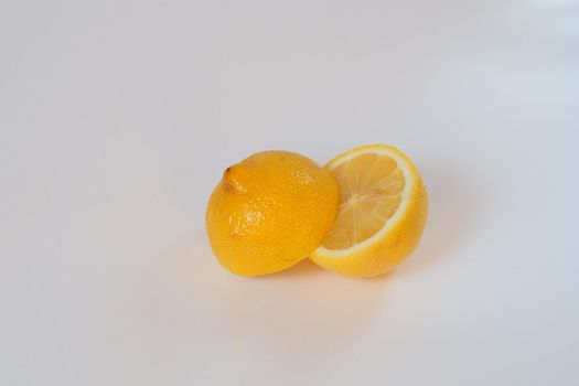 Lemon. Cut in half. Close-up, white background. High quality photo. High quality photo