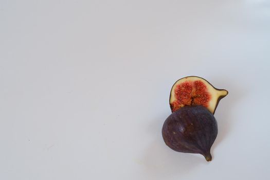 Food. Exotic fruit. Purple figs close up on a white background. High quality photo