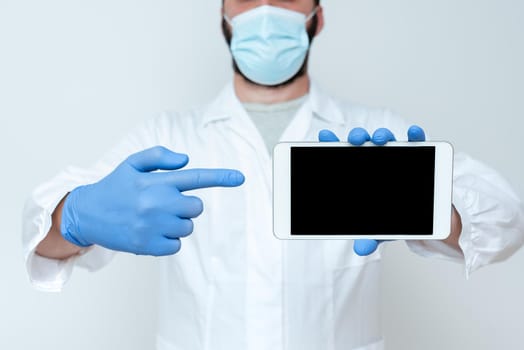 Male doctor holding tablet computer and virtual screen with picture of lungs on color background close-up of blank tablet screen in doctor hands Asian doctor or nurse holding tablet computer