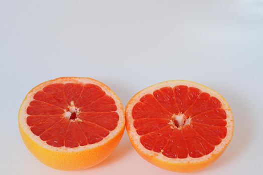 Fruits are citrus fruits. Red grapefruit cut in half. High quality photo