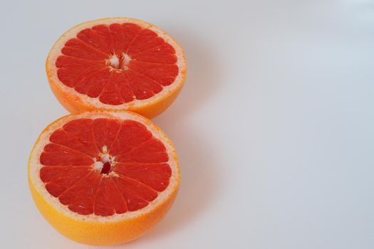 Fruits are citrus fruits. Red grapefruit cut in half. High quality photo