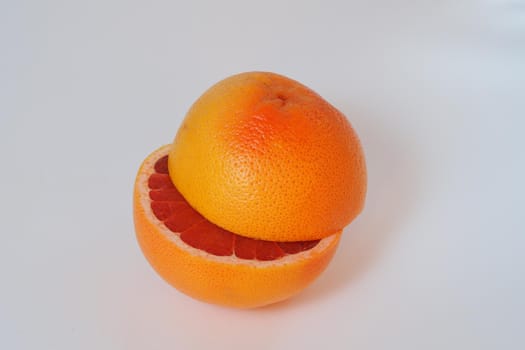 Fruits are citrus fruits. Red grapefruit cut in half. High quality photo