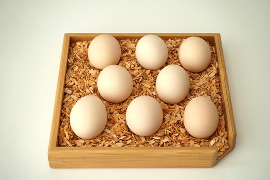 chicken eggs in a packachicken eggs in a package home village, large in an egg boxge homemade rustic. High quality photo