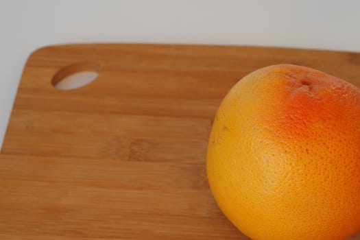 Citrus fruits. Orange on a wooden background. High quality photo