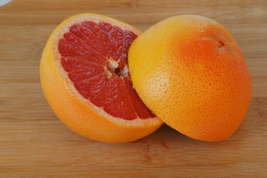 Fruits are citrus fruits. Red grapefruit cut in half. High quality photo