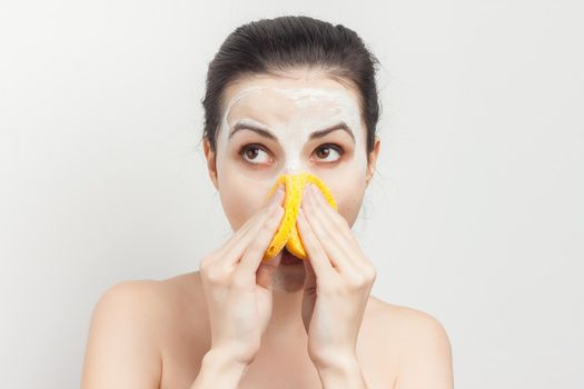 brunette with bare shoulders skin care cream cosmetics hygiene. High quality photo