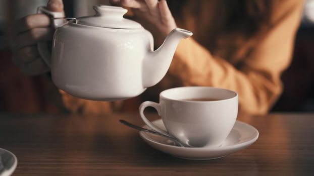 tea in a teapot mug on the table cafe breakfast How to rest. High quality photo