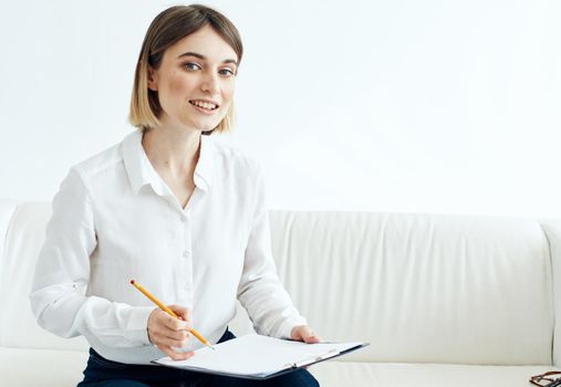 woman indoors in shirt with document folder in hands mockup. High quality photo