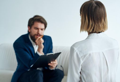 Men and women in suits of colleagues at work office communicating. High quality photo