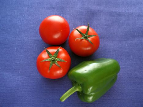 Food. Ripe vegetables close-up. Red tomatoes, cucumber, bell pepper