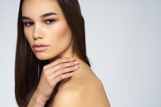 cute brunette bare shoulders clear skin cropped view. High quality photo