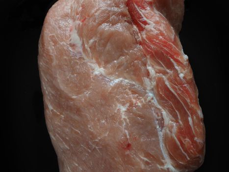 Fresh raw meat. A large piece of pork for baking. Close-up. Horizontal image.