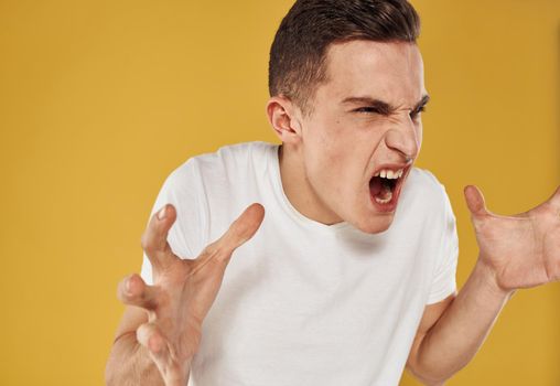 Emotional man gestures with his hands emotion model irritability stress. High quality photo