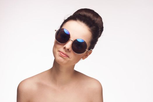 pretty woman naked shoulders fashion glasses studio luxury. High quality photo