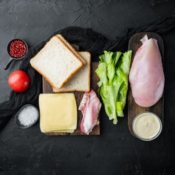 Delicious sandwich with toasted bread ingredient, on black background, top view