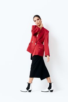 brunette in red blazer fashion clothes studio posing model. High quality photo