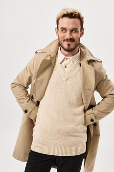 man in beige coat autumn style look aside isolated background. High quality photo