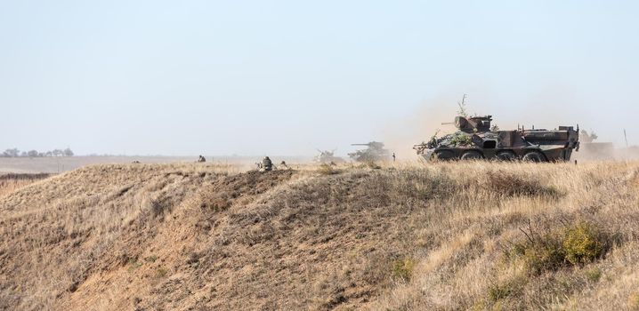 DONETSK REG, UKRAINE - Okt 12, 2018: Military equipment at a military training ground during complex tactical exercises of diverse military forces for the defense of coastal area in the Donetsk region