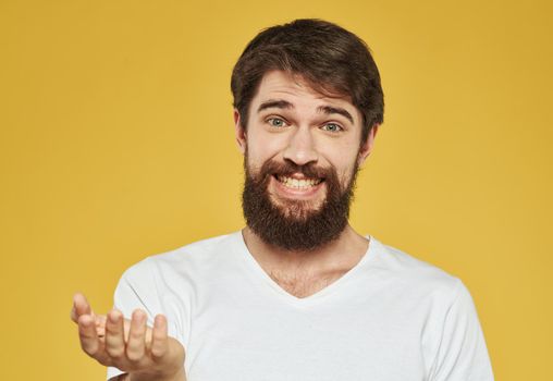Close up portrait of a man with a brunet beard in a white t-shirt. High quality photo