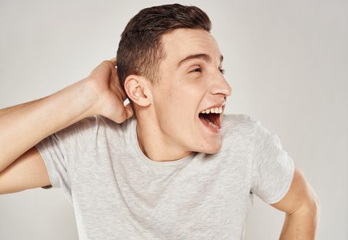 Cheerful man t-shirt emotions hand gestures close-up. High quality photo