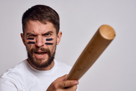 Sports man t-shirt baseball bat workout emotions. High quality photo