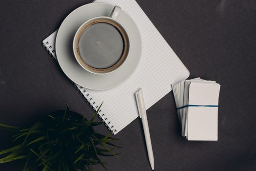 coffee cup desktop business card pen office close-up. High quality photo