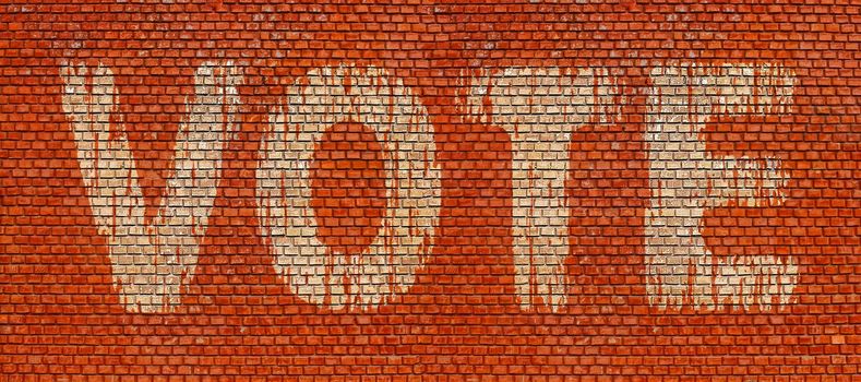 Word Vote on red brick wall background