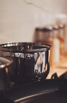 Aluminium pot on a kitchen stove, cookware and cooking concept