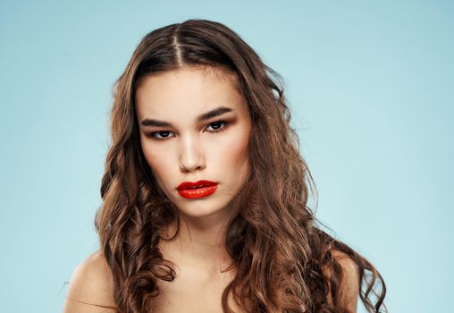 Sexy model with red lips nude shoulders makeup cropped look. High quality photo