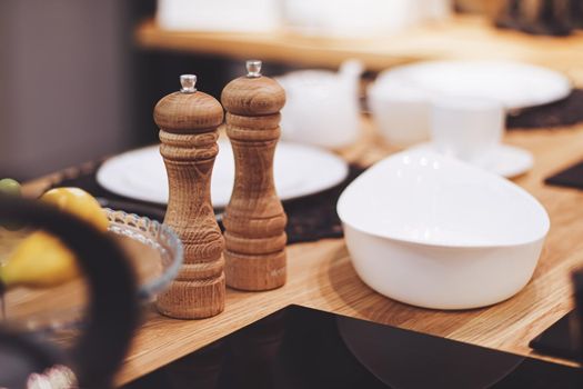 Wooden salt and pepper shaker set in the kitchen, eco-friendly product and home decor idea