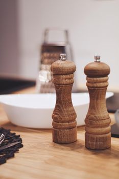 Wooden salt and pepper shaker set in the kitchen, eco-friendly product and home decor idea