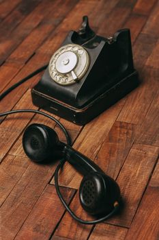 retro telephone nostalgia old technology communication wooden background. High quality photo