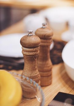 Wooden salt and pepper shaker set in the kitchen, eco-friendly product and home decor idea