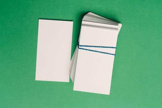 business cards on a green background office desk finance. High quality photo