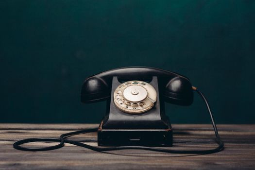 black retro telephone on the table office old technology call antique. High quality photo